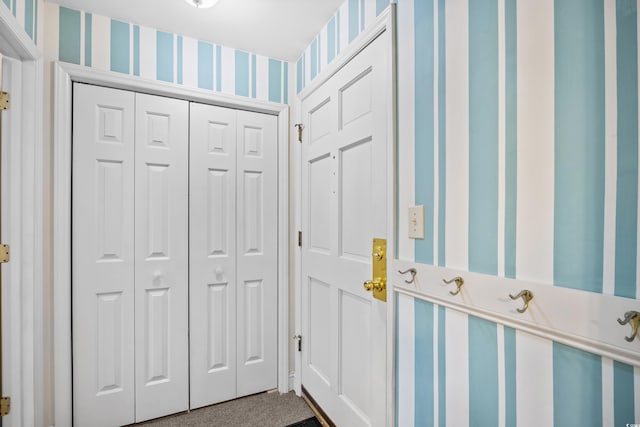 doorway with wallpapered walls