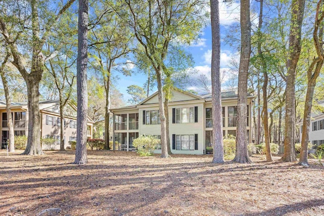 view of front of house featuring a sunroom