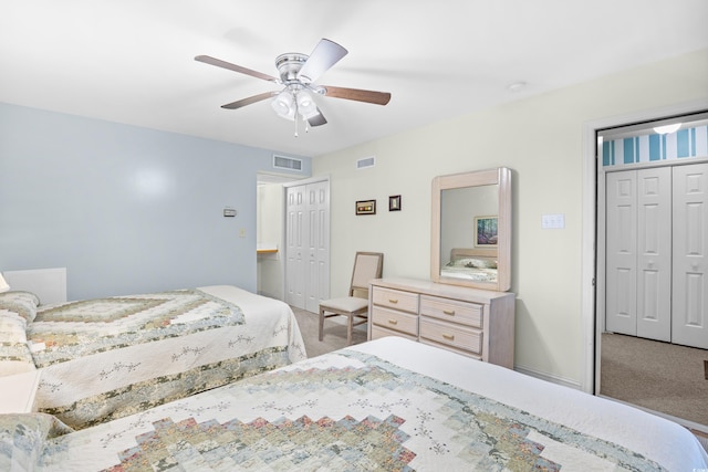 carpeted bedroom with a closet and ceiling fan