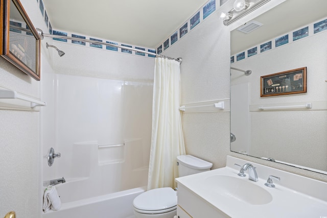 bathroom featuring toilet, shower / bath combo, vanity, and a textured wall