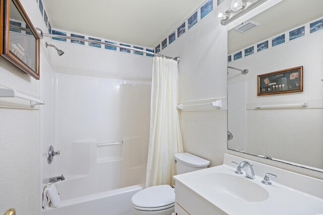 95 Weehawka Way Unit 2, Pawleys Island, SC 29585 - bathroom featuring toilet, shower / bath combo, vanity, and a textured wall