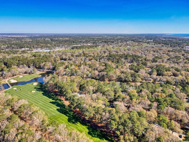 aerial overview of property's location with a large body of water, a golf club, and a forest