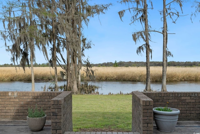exterior space with a water view