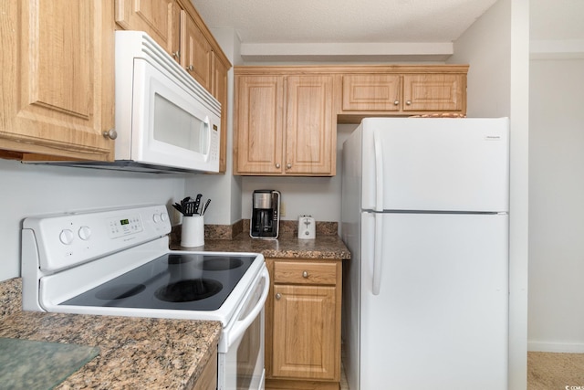 5905 S Kings Hwy Unit 439-B, Myrtle Beach, SC 29577 - kitchen with white appliances and dark countertops