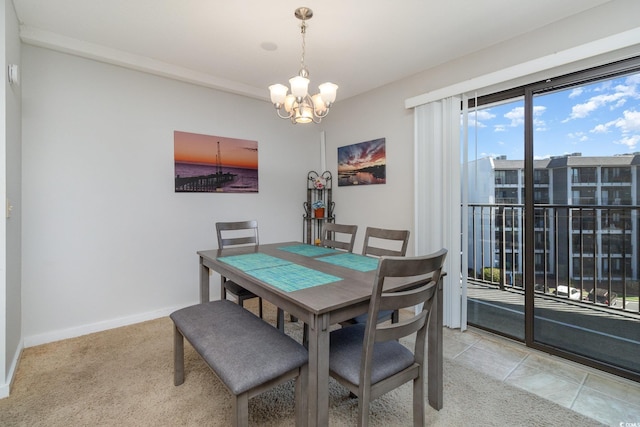 5905 S Kings Hwy Unit 439-B, Myrtle Beach, SC 29577 - dining area featuring baseboards, light carpet, and a chandelier