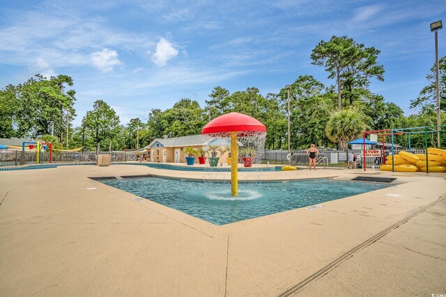 5905 S Kings Hwy Unit 439-B, Myrtle Beach, SC 29577 - community pool featuring a patio area, playground community, and fence
