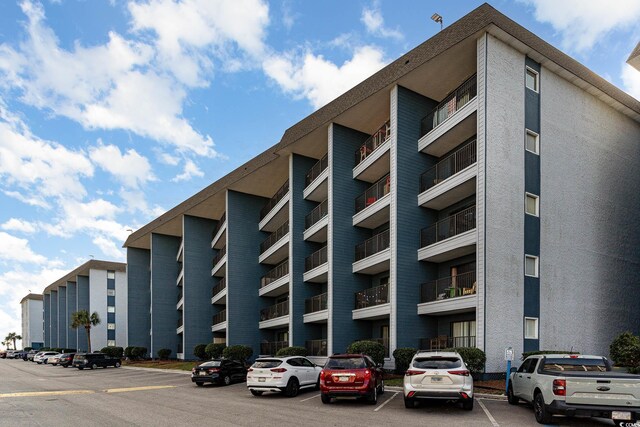5905 S Kings Hwy Unit 439-B, Myrtle Beach, SC 29577 - view of building exterior with uncovered parking