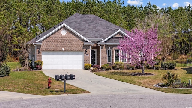 1112 Raven Cliff Ct, Conway, SC 29526 - view of front facade with brick siding, a garage, driveway, and a front lawn