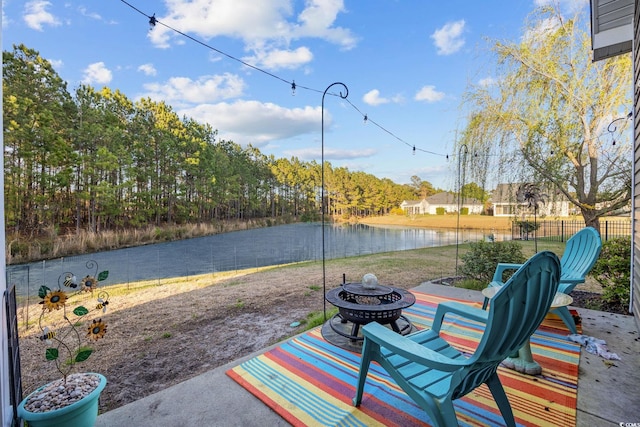 1112 Raven Cliff Ct, Conway, SC 29526 - fenced backyard featuring an outdoor fire pit, a water view, and a patio
