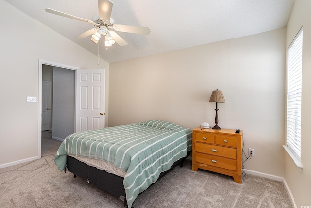 bedroom with carpet floors, baseboards, lofted ceiling, and a ceiling fan