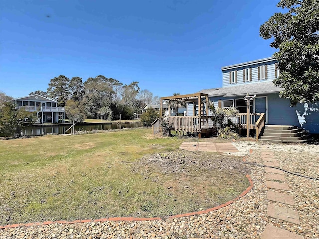 613 23rd Ave N, North Myrtle Beach, SC 29582 - view of green lawn featuring a deck with water view