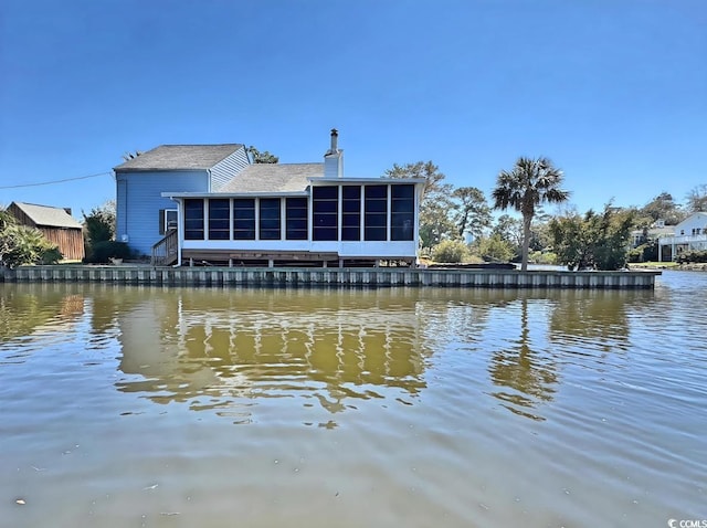 613 23rd Ave N, North Myrtle Beach, SC 29582 - back of property featuring a sunroom and a water view