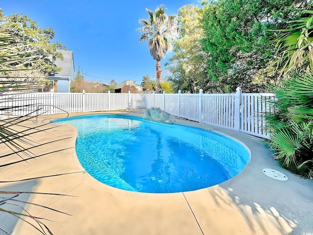 613 23rd Ave N, North Myrtle Beach, SC 29582 - view of swimming pool featuring fence