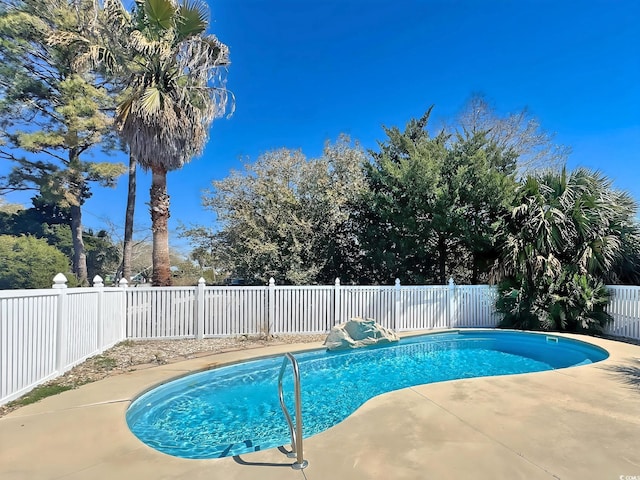 613 23rd Ave N, North Myrtle Beach, SC 29582 - view of pool with a fenced backyard and a patio