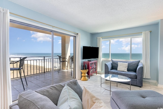 707 S Ocean Blvd Unit 602, North Myrtle Beach, SC 29582 - living room with a textured ceiling and baseboards