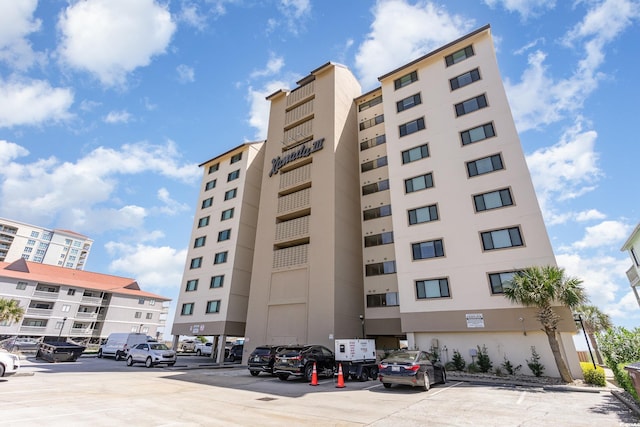 707 S Ocean Blvd Unit 602, North Myrtle Beach, SC 29582 - view of building exterior with uncovered parking