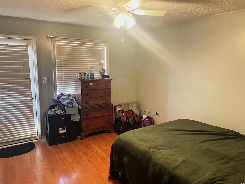 510 Fairwood Lakes Dr Unit 18J, Myrtle Beach, SC 29588 - bedroom with light wood-style floors and a ceiling fan