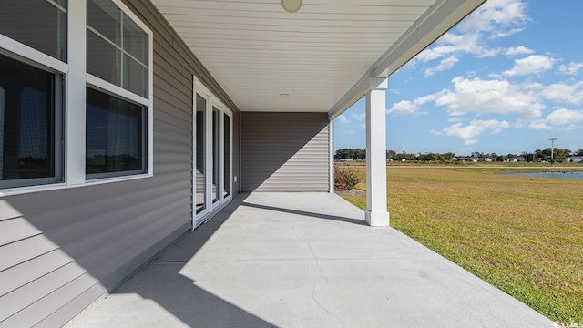 view of patio featuring a water view