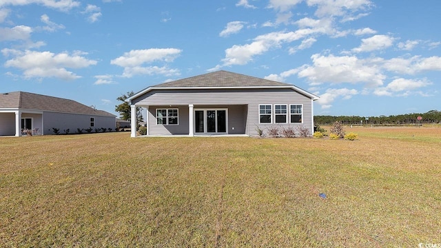 back of house featuring a yard