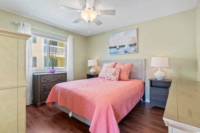 1425 N Waccamaw Dr Unit 123, Garden City Beach, SC 29576 - bedroom with dark wood finished floors, a textured ceiling, and ceiling fan
