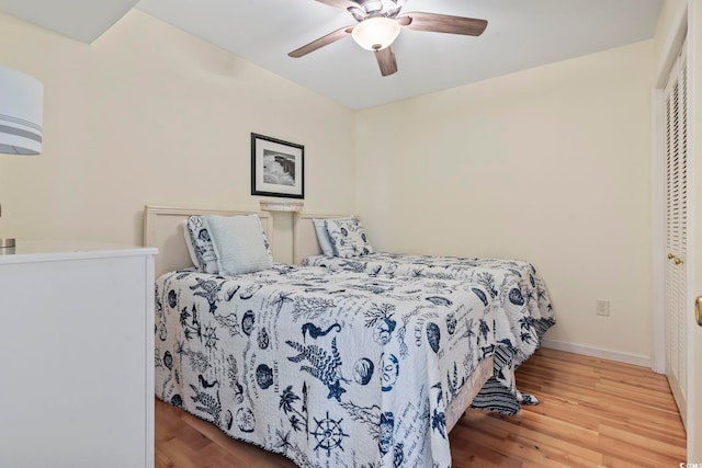 1425 N Waccamaw Dr Unit 123, Garden City Beach, SC 29576 - bedroom with wood finished floors, baseboards, and a ceiling fan