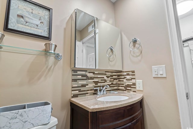 1425 N Waccamaw Dr Unit 123, Garden City Beach, SC 29576 - half bath with decorative backsplash, vanity, and toilet