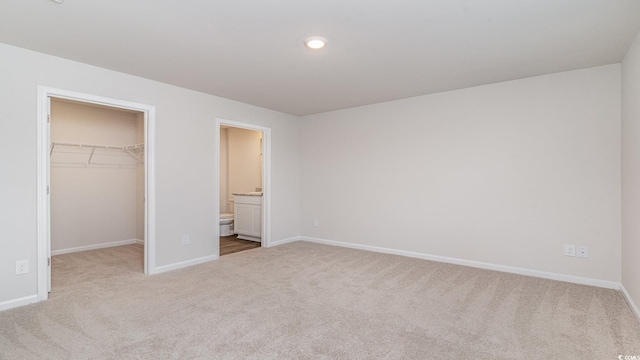 1458 Nokota Dr, Conway, SC 29526 - unfurnished bedroom featuring carpet, a spacious closet, ensuite bath, and recessed lighting