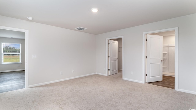 1458 Nokota Dr, Conway, SC 29526 - unfurnished bedroom with carpet floors and a walk in closet