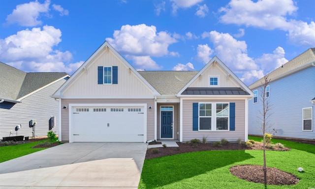 view of front facade featuring board and batten siding, driveway, and a front yard