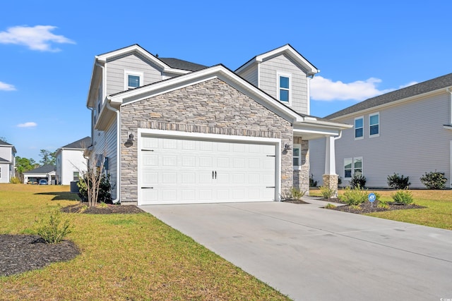 view of front facade featuring stone siding, a front lawn, driveway, and an attached garage