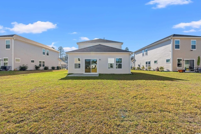 back of house featuring a yard and a patio