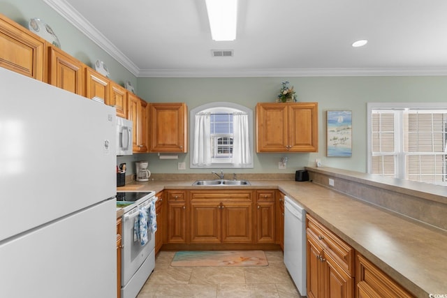 4141 Hibiscus Dr Unit 201, Little River, SC 29566 - kitchen featuring white appliances, a sink, crown molding, light countertops, and brown cabinets