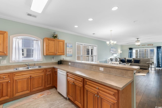 4141 Hibiscus Dr Unit 201, Little River, SC 29566 - kitchen featuring a sink, dishwasher, a peninsula, crown molding, and open floor plan