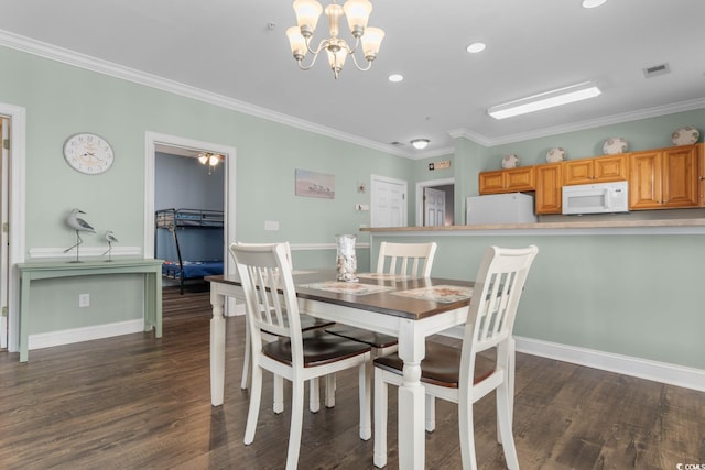 4141 Hibiscus Dr Unit 201, Little River, SC 29566 - dining room with crown molding, dark wood finished floors, a chandelier, recessed lighting, and baseboards