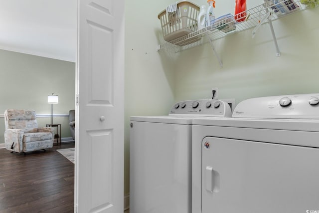 4141 Hibiscus Dr Unit 201, Little River, SC 29566 - washroom featuring washing machine and dryer, dark wood finished floors, baseboards, and ornamental molding