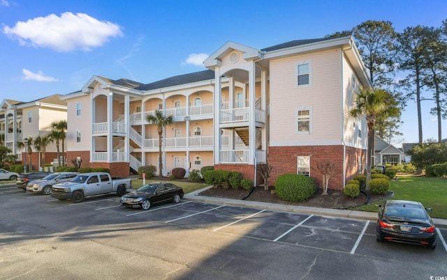 4141 Hibiscus Dr Unit 201, Little River, SC 29566 - view of apartment building / complex featuring uncovered parking and stairway
