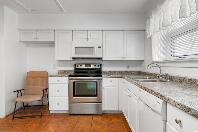3494 Cactus St Unit 3494, Myrtle Beach, SC 29577 - kitchen with white appliances, a sink, white cabinets, and dark tile patterned floors