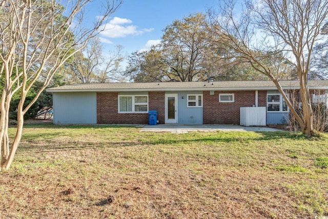 3494 Cactus St Unit 3494, Myrtle Beach, SC 29577 - back of house with a patio area, brick siding, and a lawn