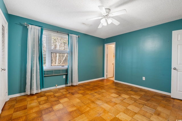3494 Cactus St Unit 3494, Myrtle Beach, SC 29577 - empty room featuring a textured ceiling, ceiling fan, and baseboards