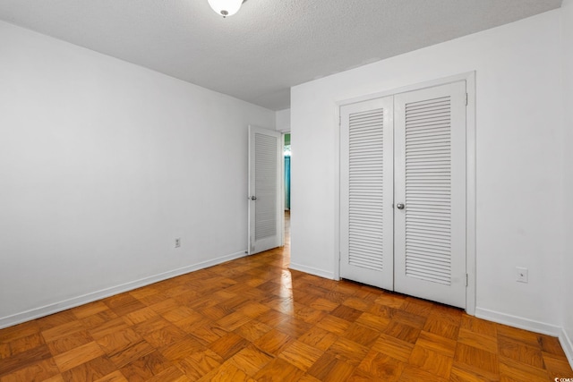 3494 Cactus St Unit 3494, Myrtle Beach, SC 29577 - unfurnished bedroom featuring baseboards, a closet, and a textured ceiling