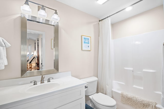 full bath with shower / bathtub combination with curtain, vanity, and toilet