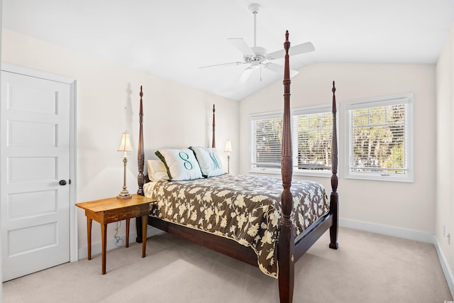 bedroom with light colored carpet, baseboards, a ceiling fan, and lofted ceiling