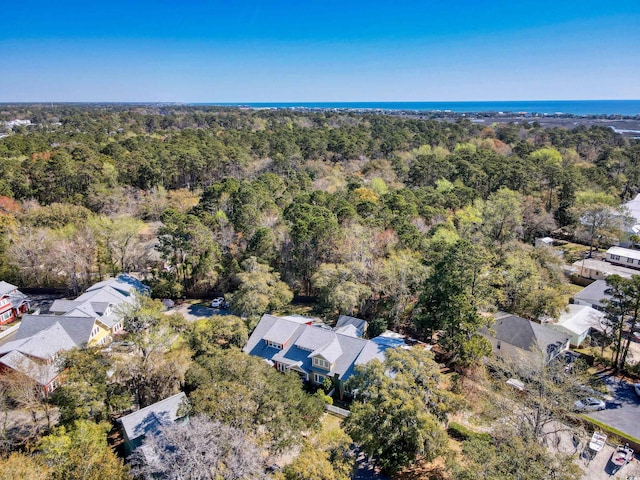 birds eye view of property with a view of trees and a residential view