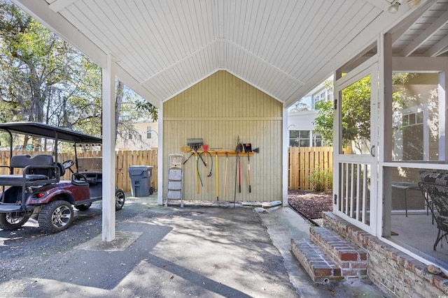 view of patio / terrace featuring a carport and fence