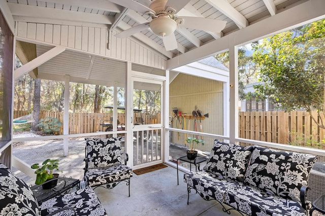 view of patio with an outdoor living space, fence, and ceiling fan