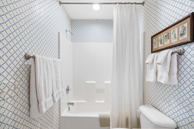 full bathroom featuring shower / tub combo and toilet