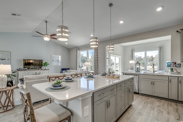 5504 Shelly Lynn Dr, Myrtle Beach, SC 29579 - kitchen featuring visible vents, stainless steel dishwasher, open floor plan, a sink, and gray cabinetry