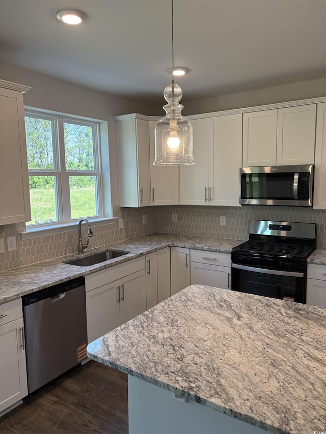 5504 Shelly Lynn Dr, Myrtle Beach, SC 29579 - kitchen with a sink, appliances with stainless steel finishes, white cabinets, and backsplash