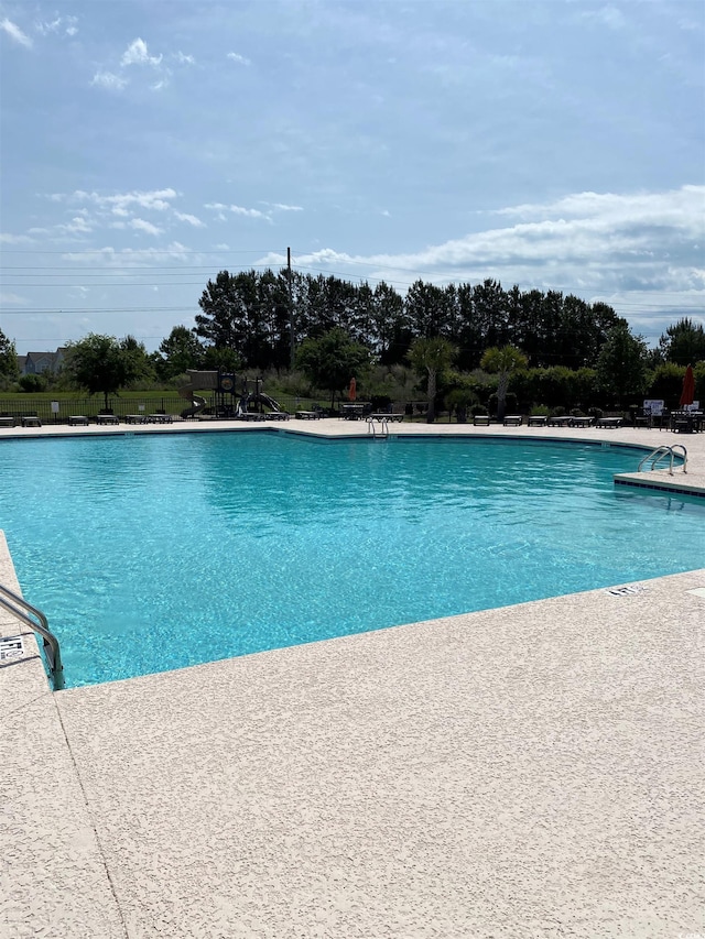 5504 Shelly Lynn Dr, Myrtle Beach, SC 29579 - community pool featuring fence and a patio area
