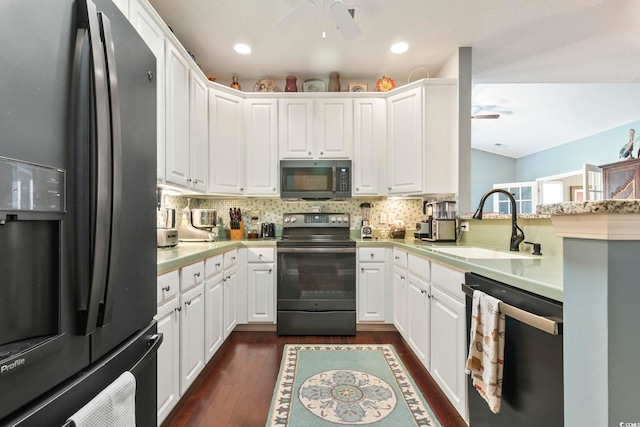 kitchen featuring stainless steel appliances, a ceiling fan, light countertops, and a sink